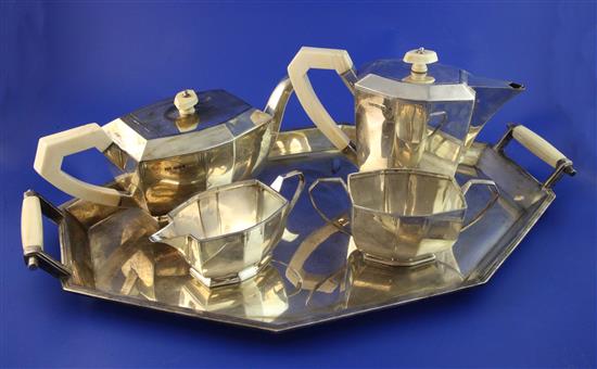 A 1930s Art Deco silver and ivory mounted five piece tea service, tray 21in over handles.